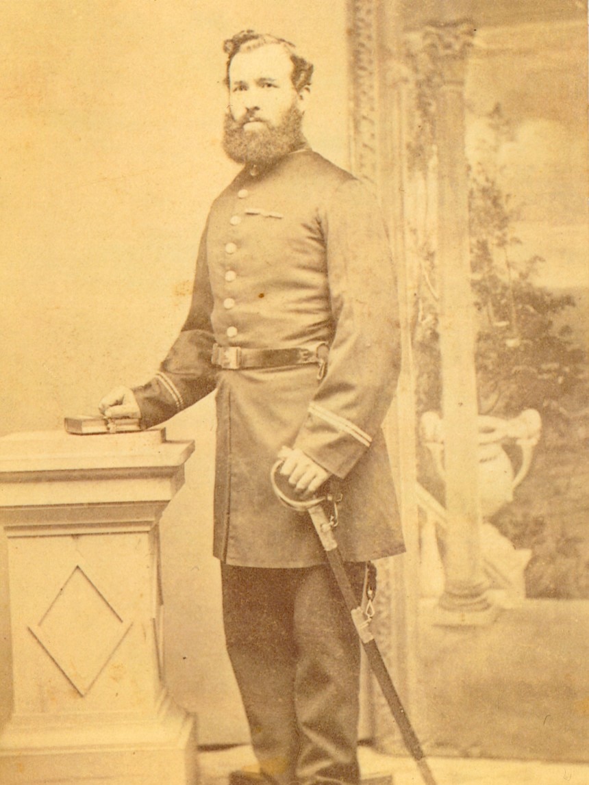 A sepia photo of a man in a uniform.