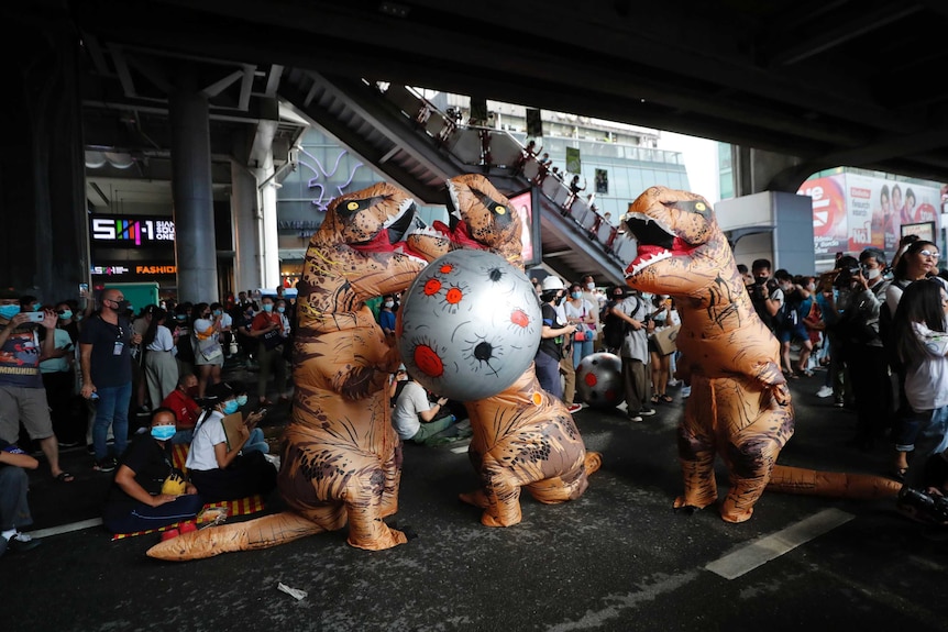 Inflatable dinosaurs on a Bangkok street.