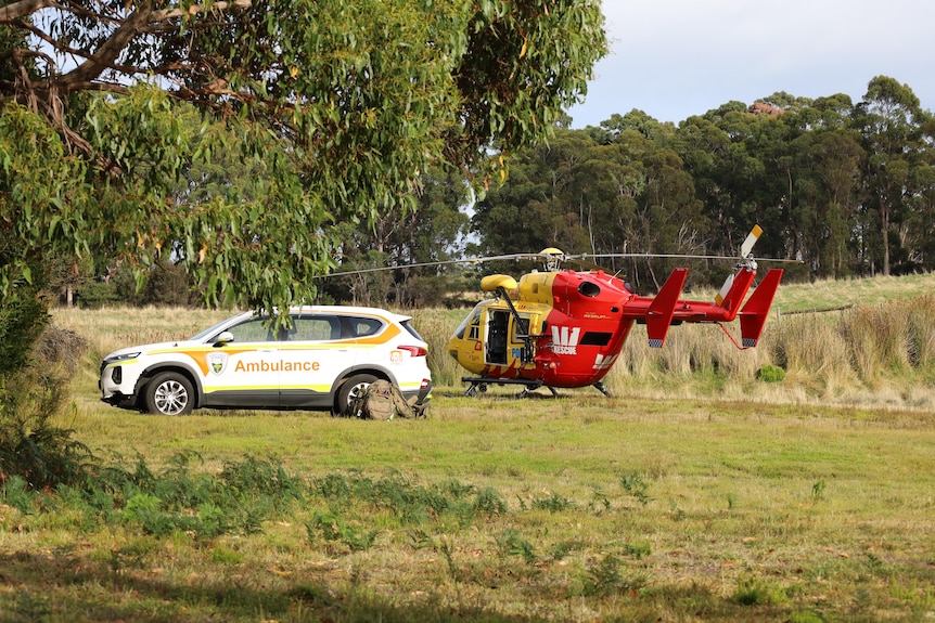 A helicopter in a field.