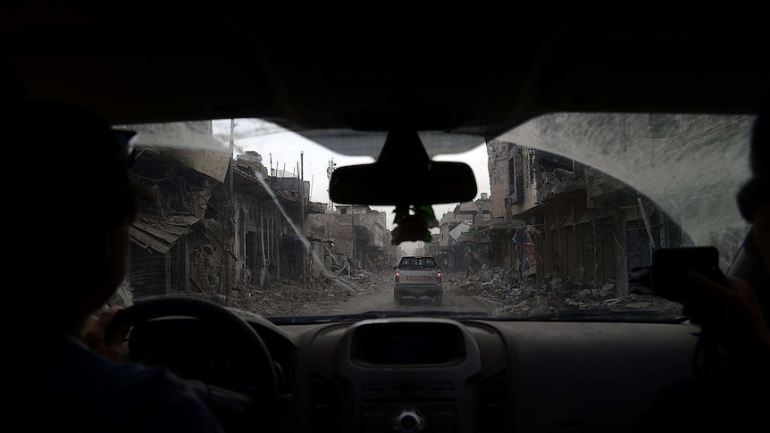 A street which has been destroyed by violence in Iraq.