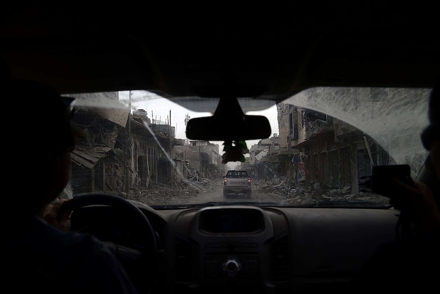 A street which has been destroyed by violence in Iraq.