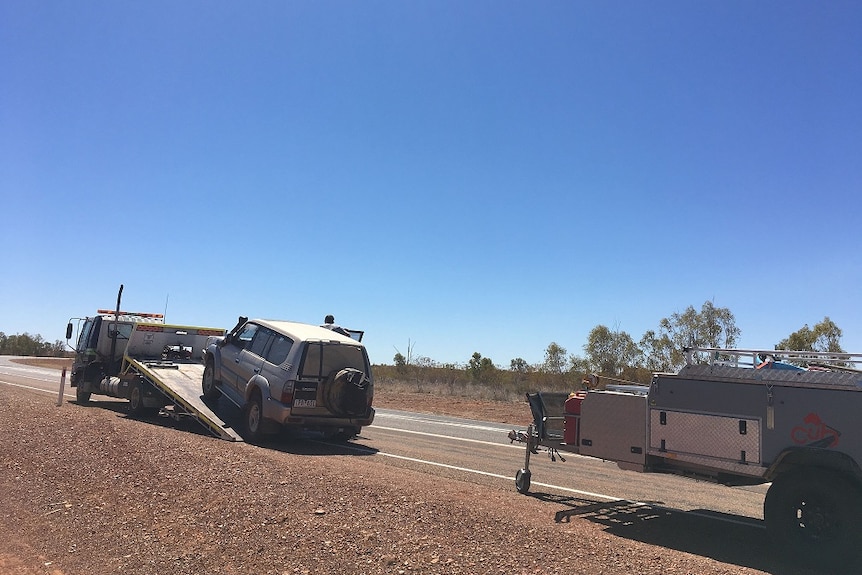 The Mifflin family's car had to be towed away for repairs in Central Australia.