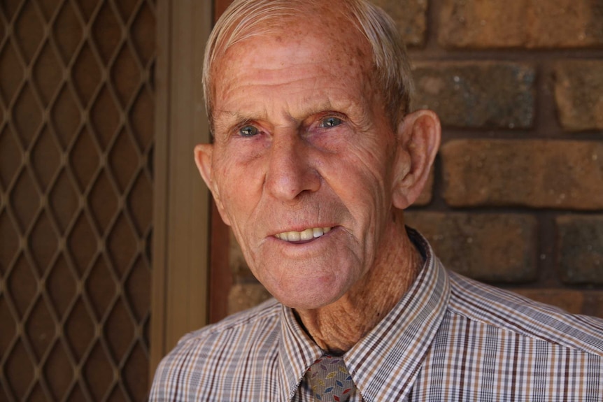 Howard Hendrick smiles at the camera at his house in Pyap, SA.