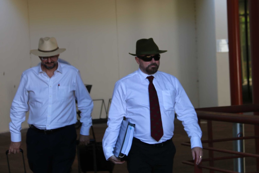 Michael Tatham (R) leaves the Darwin court.