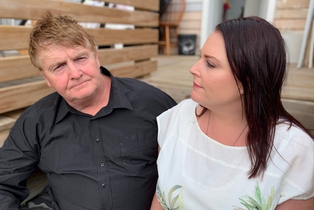 Julian and Kate Edwards sitting on a couch.