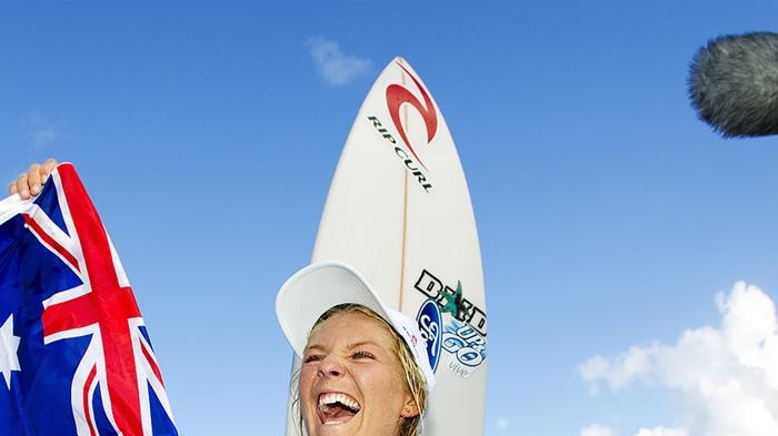 Gilmore is chaired up the beach after wrapping up her fourth world title.