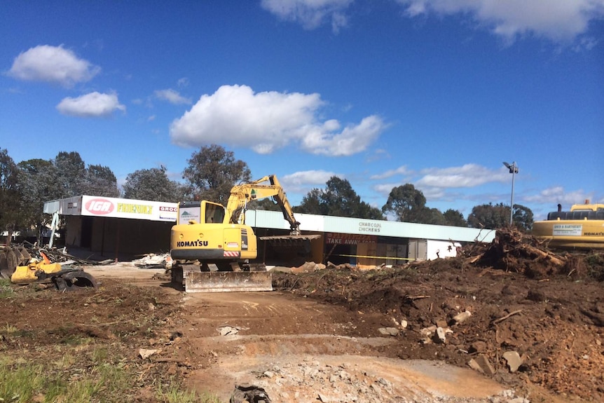 Despite on-going court action, work began to clear the vacant Giralang shops site last year.