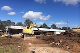 Despite on-going court action, work began to clear the vacant Giralang shops site last year.