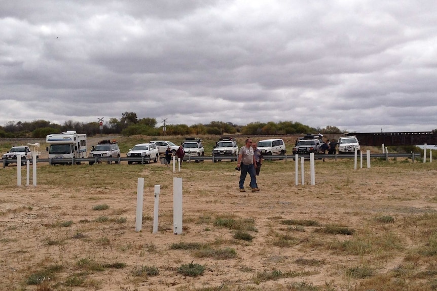 A crowd watches releases of water into Lake Menindee in October 2016.