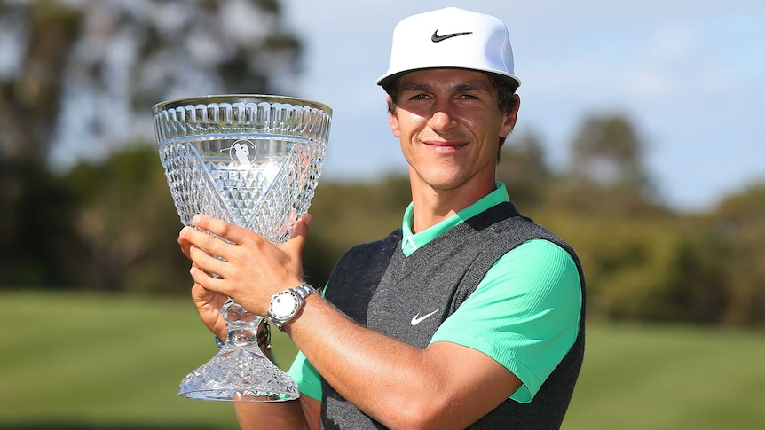 Thorbjorn Olesen poses with Perth International trophy