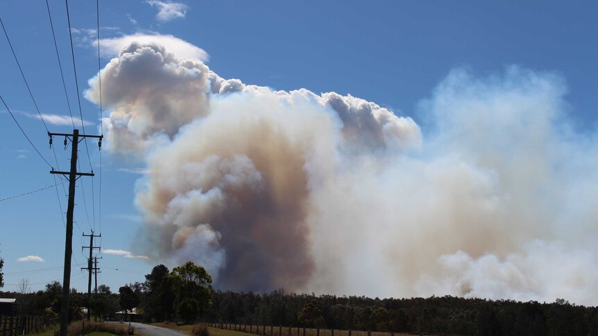 Plume of bushfire smoke near homes north-east of Kempsey, NSW - August 2017.