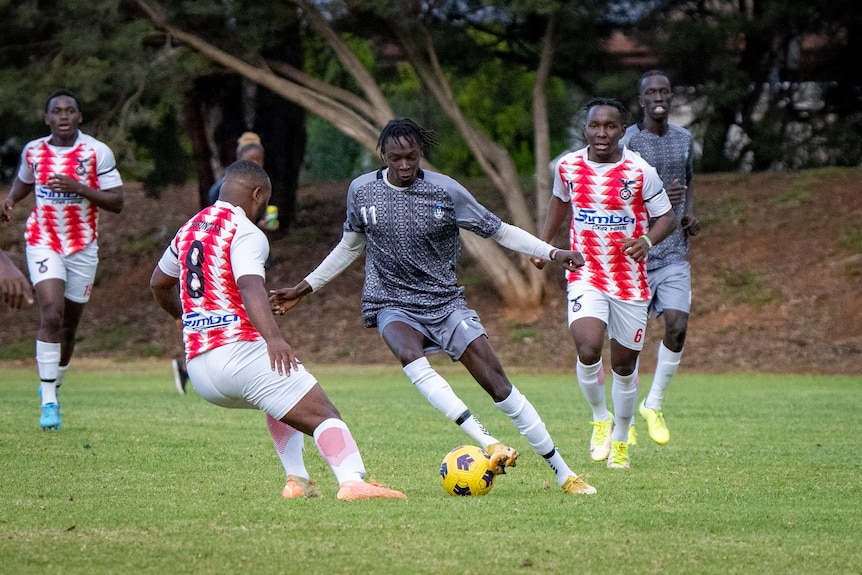 Action shot of African players in a soccer game