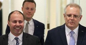 Josh Frydenberg and Scott Morrison walk down a corridor