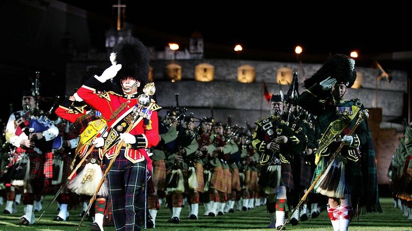 The Edinburgh Military Tattoo performs infront of a replica of Edinburgh Castle at the Sydney footba