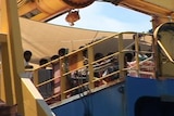 Some of the asylum seekers 7 were seen washing clothes and bathing on the deck of the Oceanic Viking.