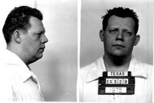 A mugshot of a man in a white shirt holding a "Texas' sign