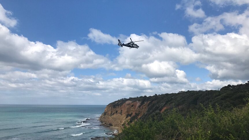 A helicopter searches for missing woman Elisa Curry at Aireys Inlet on the Surf Coast.