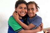 Twin brother and sister, Patricia and Angelo Gibia, from Thursday Island in a hug