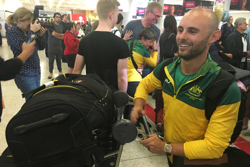 Rio winner ... Paralympic gold medallist Scott Reardon arrives back in Sydney