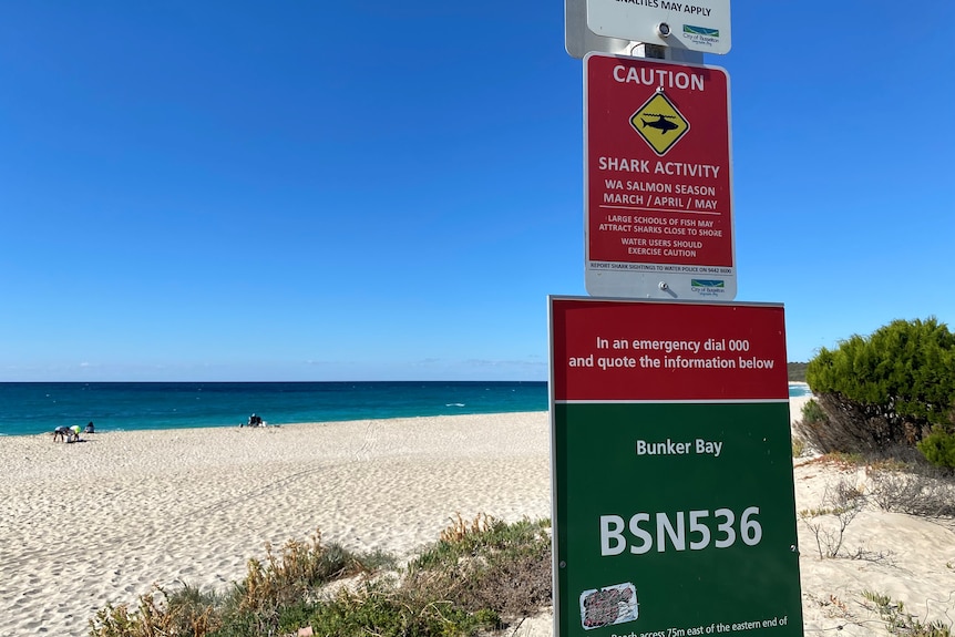 A shark warning sign on a beach in Western Australia.