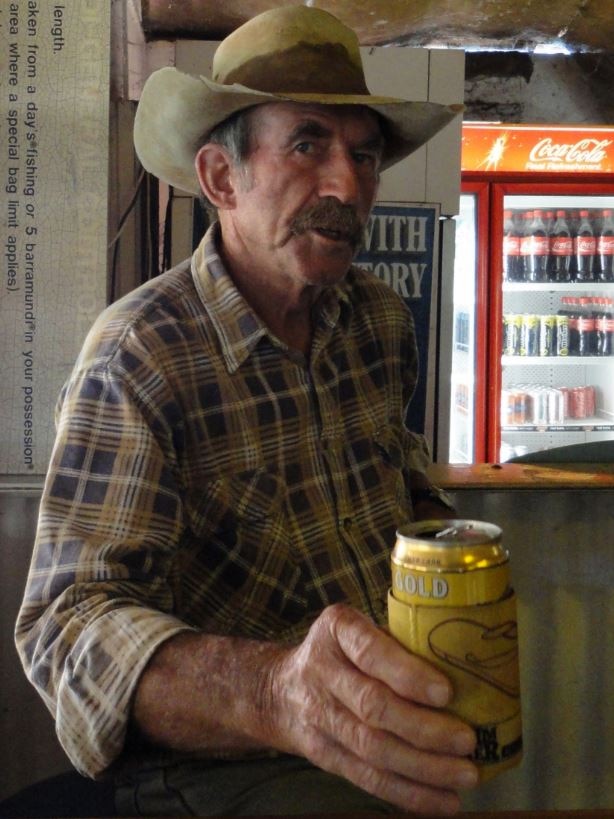 Paddy Moriarty holds a beer in a pub.