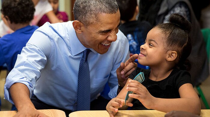 President Barack Obama jokes with young girl