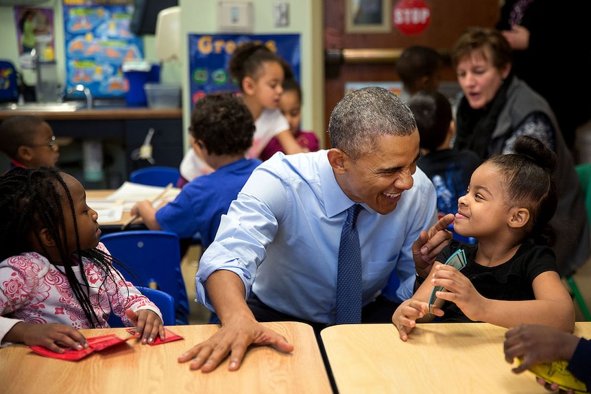 President Barack Obama jokes with young girl