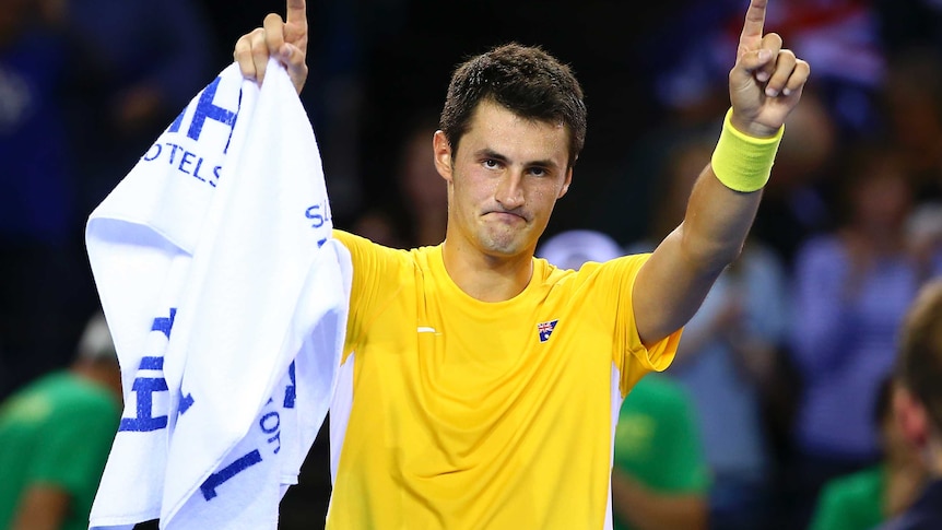 Bernard Tomic celebrates winning Davis Cup tie