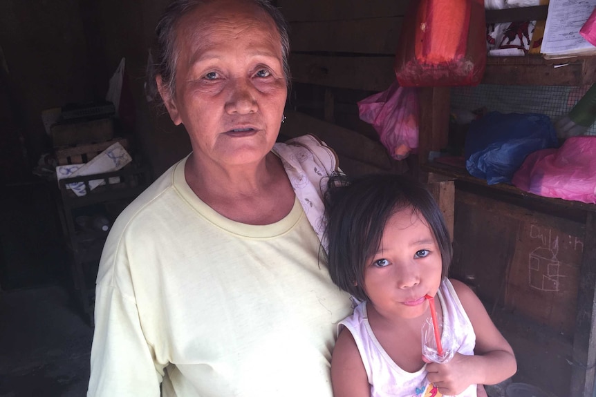 Clarita Alia with her granddaughter Cristina, 5