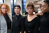 Four candidates from the Women's Equality Party pose in their office.