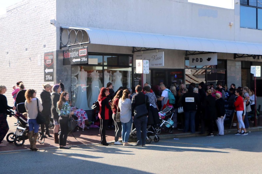 Bridal dress giveaway attracts crowds.