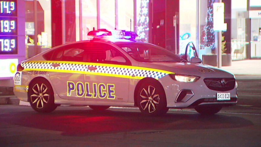 A police car with its flashing lights on.