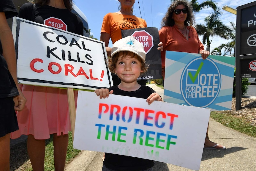 Three-year-old Joah Fanning amid an anti-Adani protest outside Proserpine Hospital in north Queensland