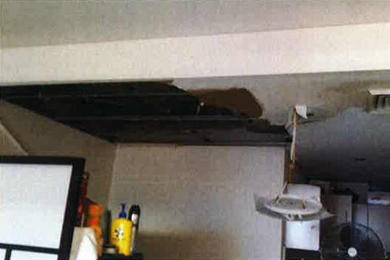 A water damaged ceiling inside an apartment.