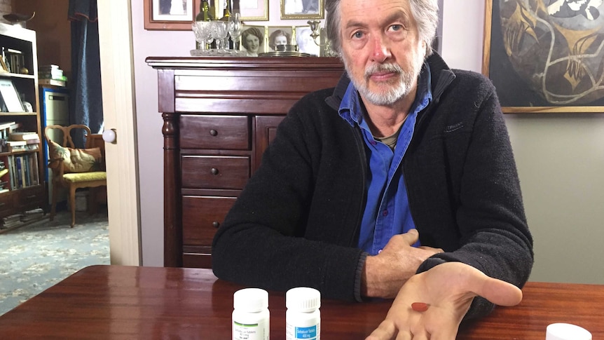 Greg Jefferys holding Solvadi medication that he went to India to buy