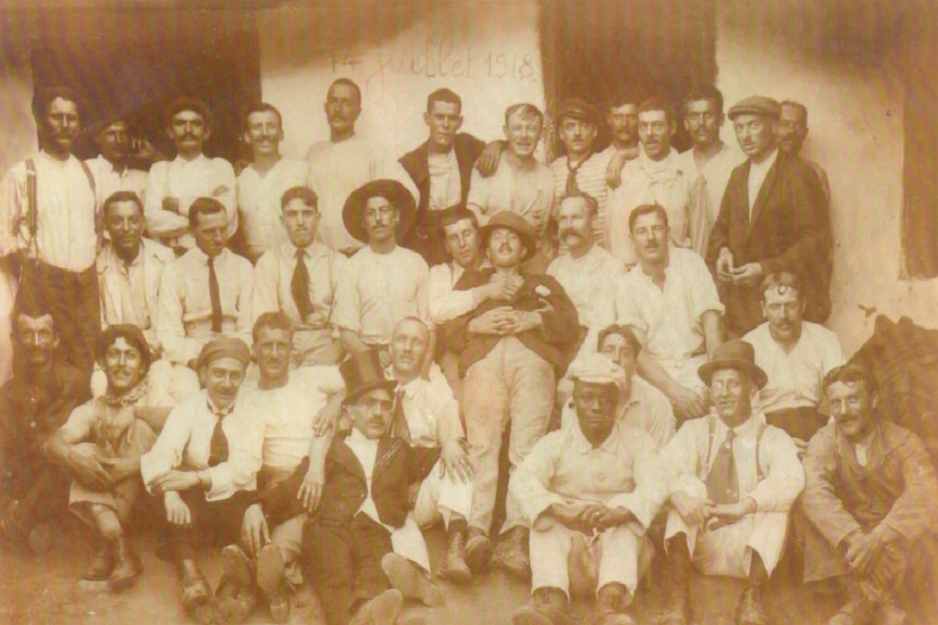 A group of men, circa 1918 gather for a group photograph