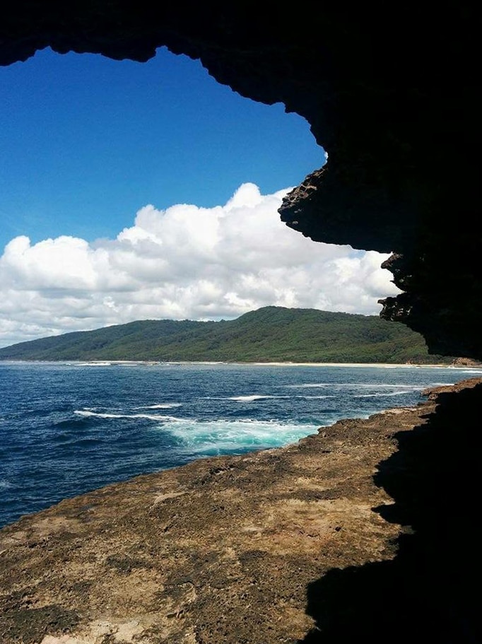 A beach with a rocky shelf.