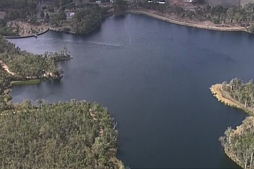 A reservoir surrounded by trees