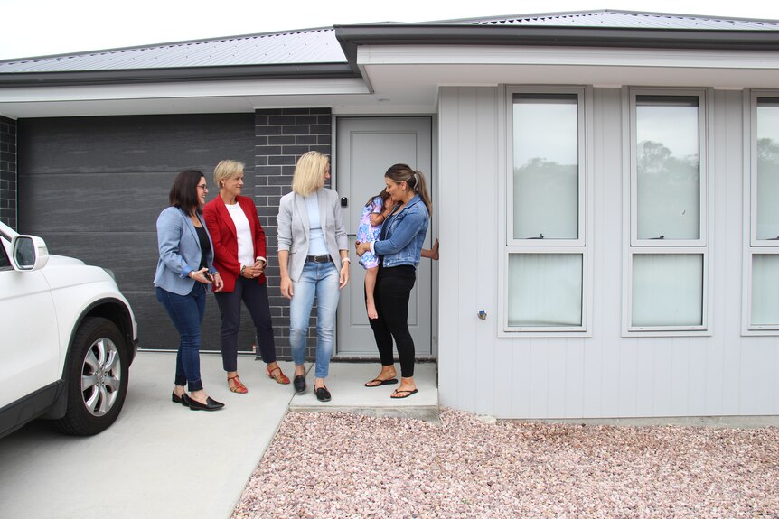 Ella Haddad, Jen Butler, Rebecca White and Sarah Miller stand on Sarah's front doorstep