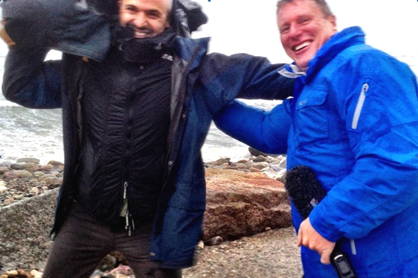ABC reporter Michael Brissenden and cameraman Louie Eroglu brave Hurricane Sandy in 2012.