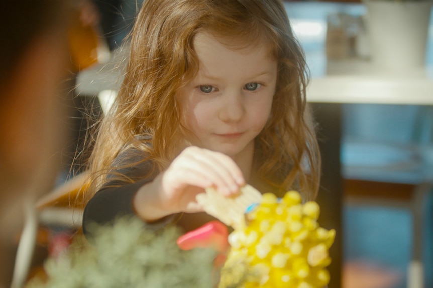 Girl eating duck cake from Children's Birthday Cake Book.