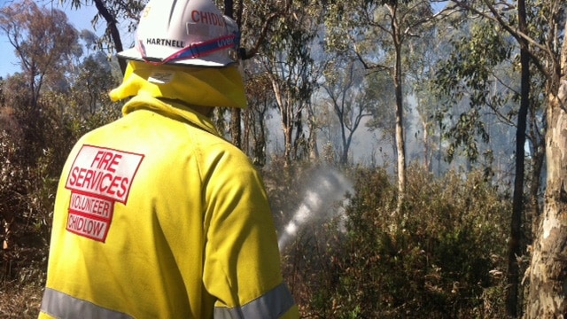 A firefighter fronts the blaze