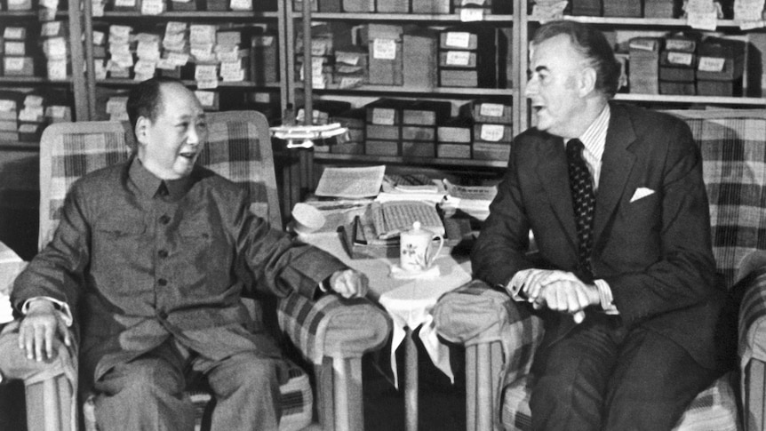 A black and white photograph of Mao Zedong and Gough Whitlam seated next to each other