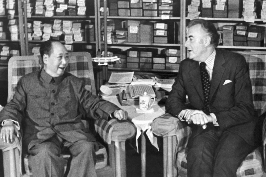 A black and white photograph of Mao Zedong and Gough Whitlam seated next to each other