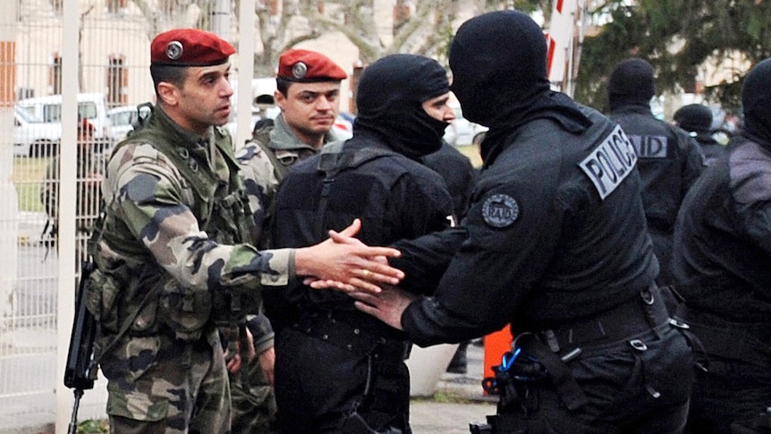 French police shake hands after marathon siege