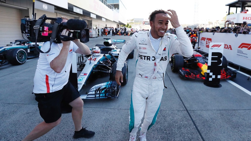 Lewis Hamilton celebrates winning Japanese GP