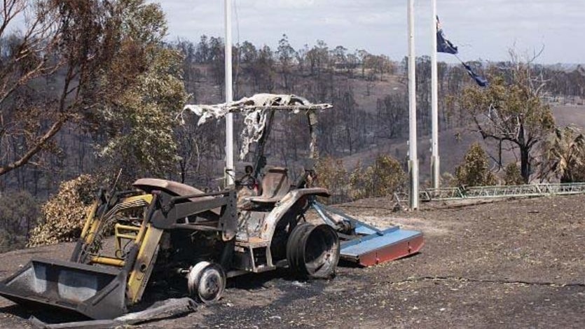 A burnt Australian flag flies at half mast at Strathewen.