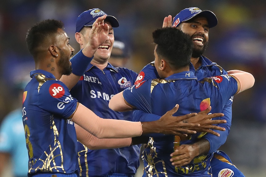 IPL players embrace as they celebrate during the 2019 season.