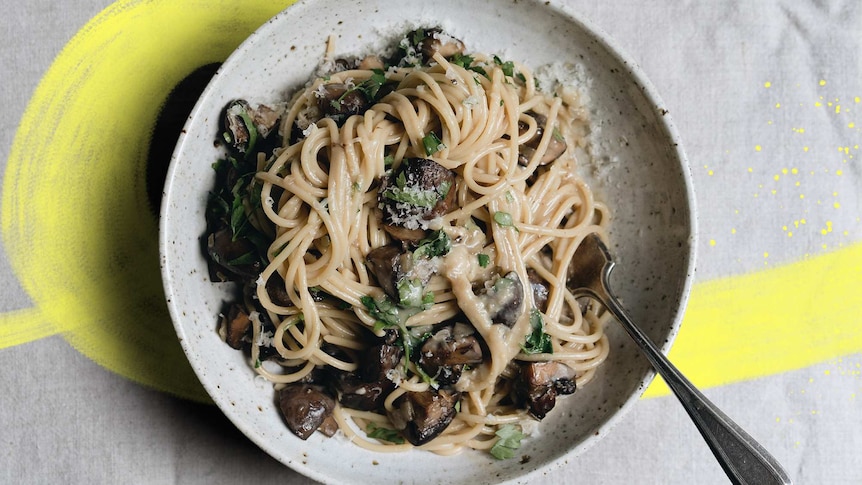 Bowl of creamy vegetarian carbonara with mushrooms, miso and parmesan, one of 14 easy and creative pasta recipes.