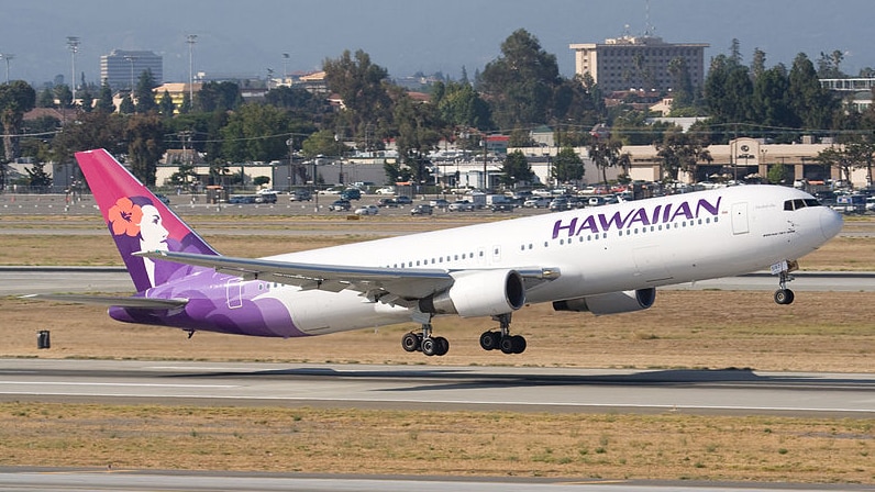 A Hawaiian Airlines plane takes off in San Jose.